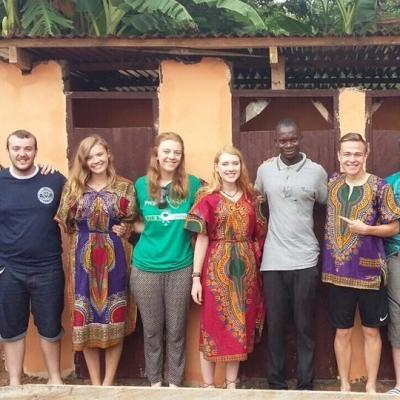 Projects Abroad volunteers pose proudly with local builders after finishing their Construction Volunteering project in Ghana A group of students built a toilet block as part of their building volunteer work in Ghana